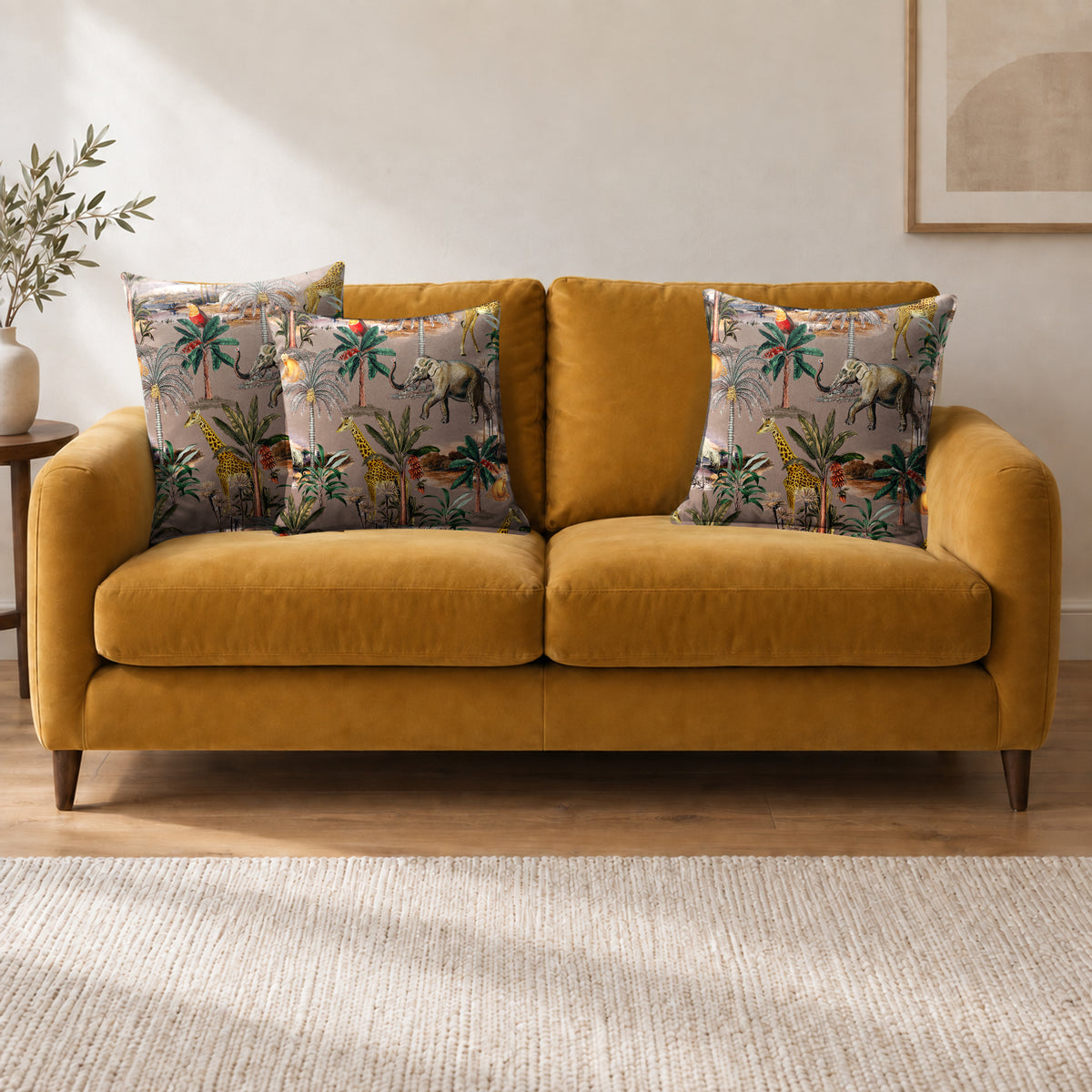 Safari Voyage cushion in Dovedale Stone on a sofa