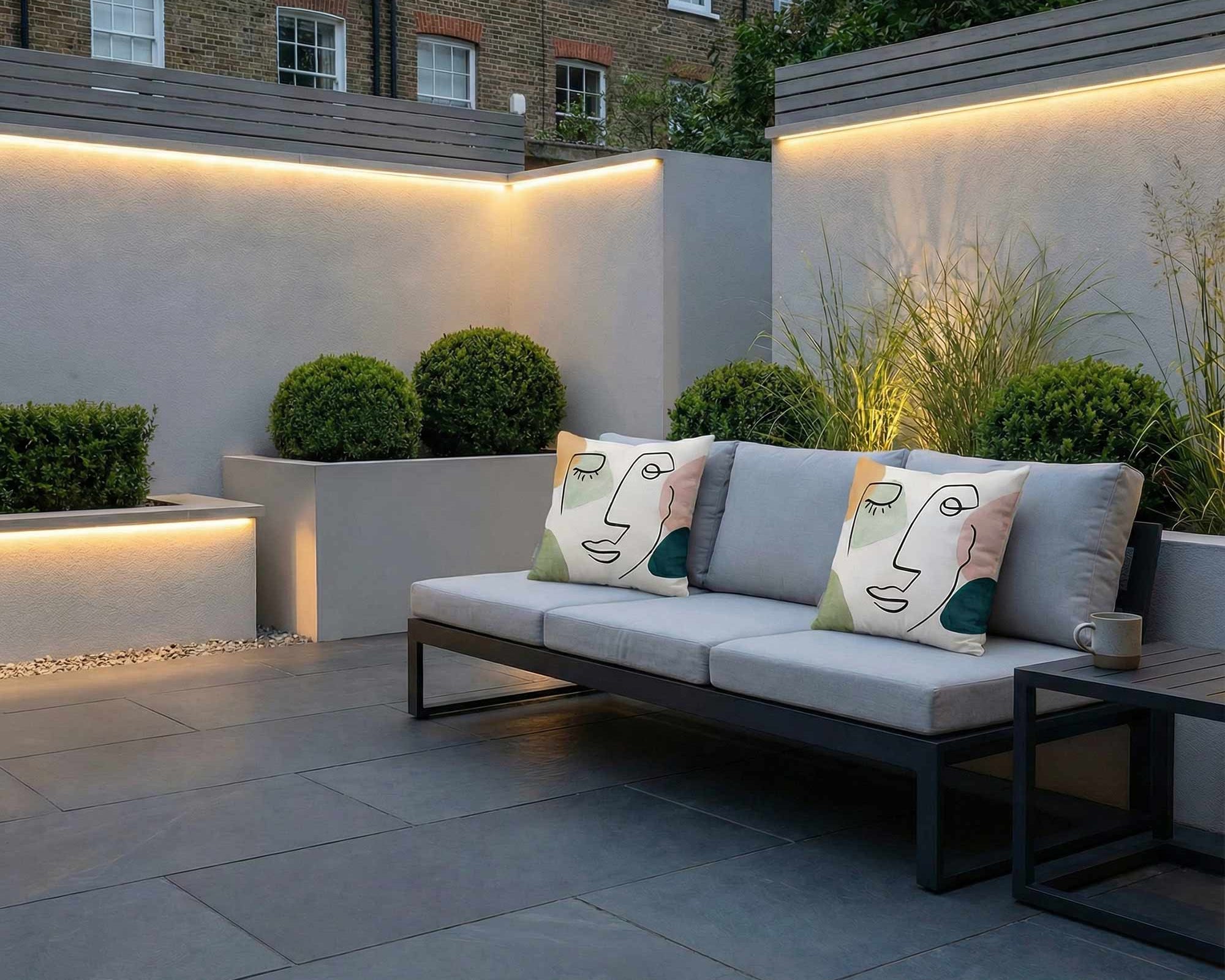 Abstract outdoor cushions on a modern garden sofa in a contemporary London terrace