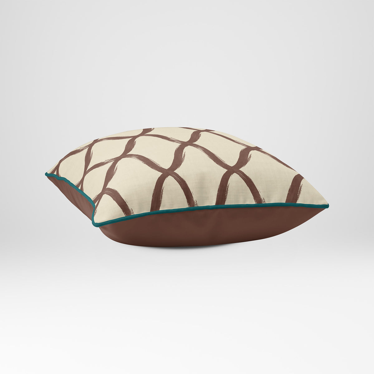 Angled view showing the front and Cocoa plain reverse of a Palace Trellis square cushion in Cocoa & Teal, finished with Deep Teal piping.