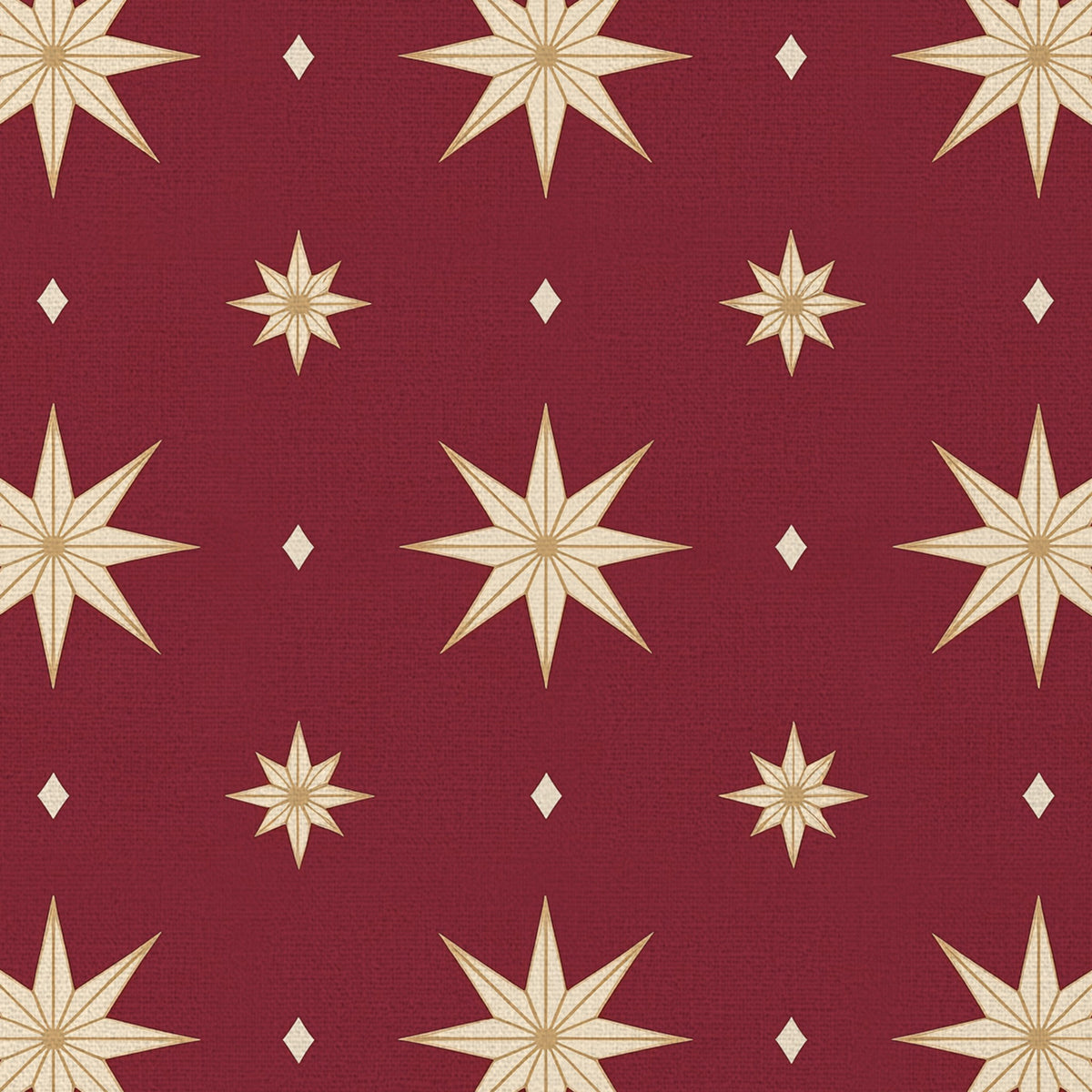 Close-up of the Stars Christmas tablecloth print in burgundy and gold on cotton, showing gold eight-pointed stars