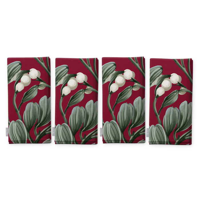 Burgundy Mistletoe Christmas napkins, set of four, folded on white, showing the same sprig of mistletoe with white berries