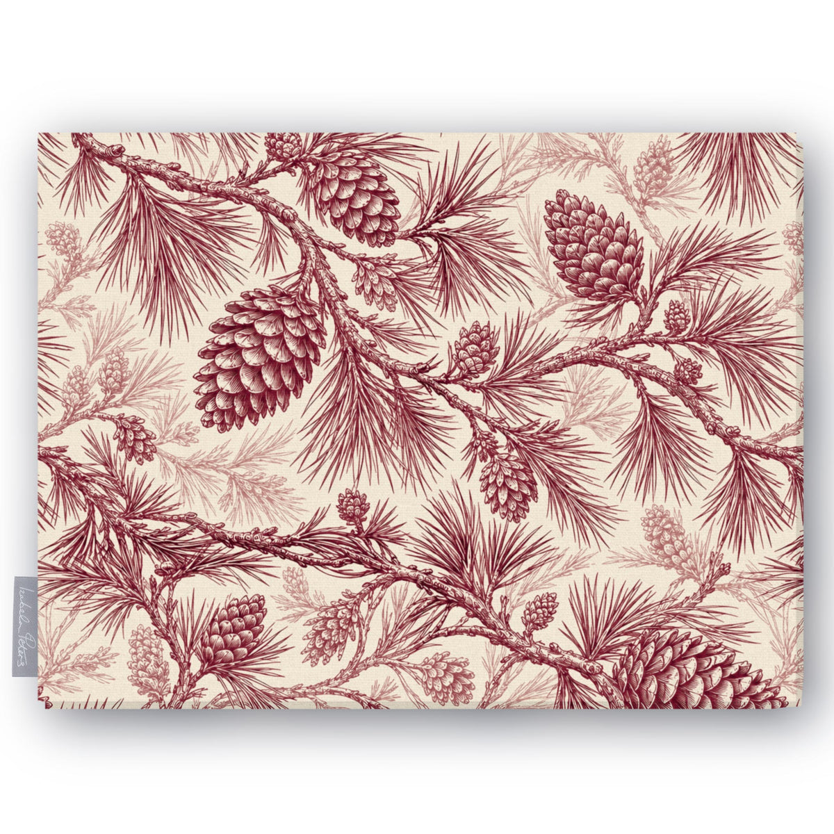 Pine Bough Christmas tablecloth in burgundy on ivory, folded on white, showing pine boughs and cones