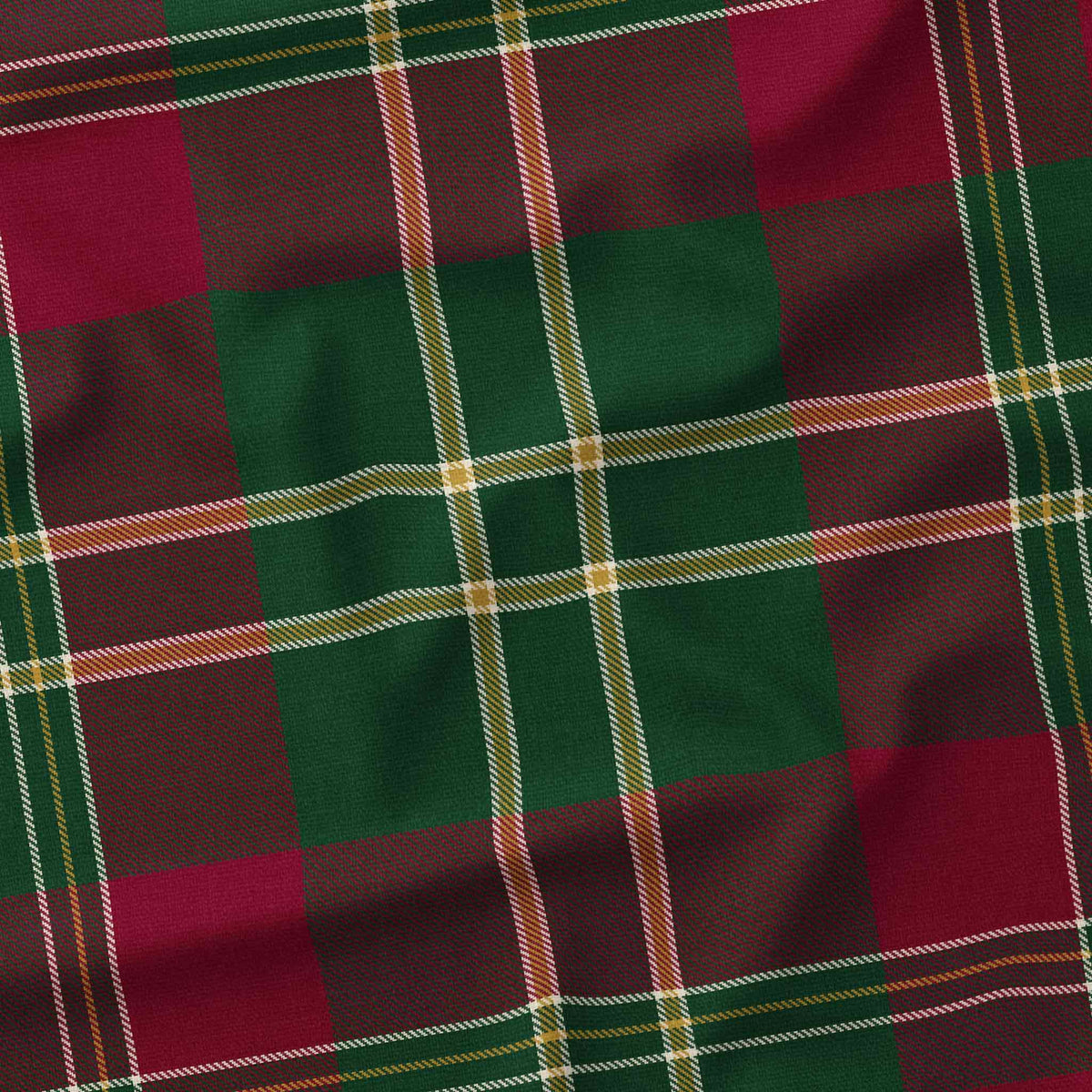 Close-up of the burgundy tartan Christmas tablecloth, showing the burgundy and deep green check and fine ivory and gold lines