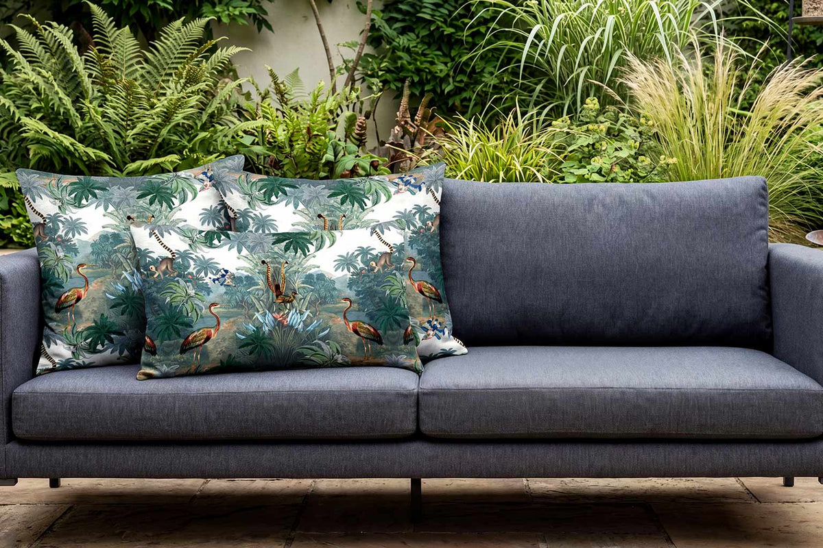 Kilimanjaro flora and fauna outdoor cushions on a charcoal grey garden sofa.
