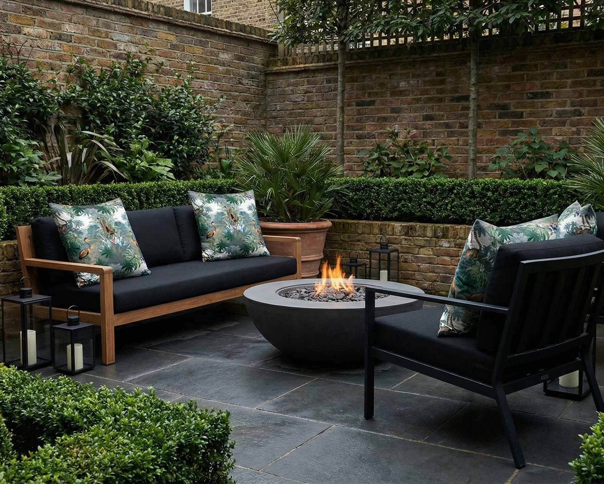 Flora and Fauna outdoor garden cushions styled on modern patio seating in a UK garden setting