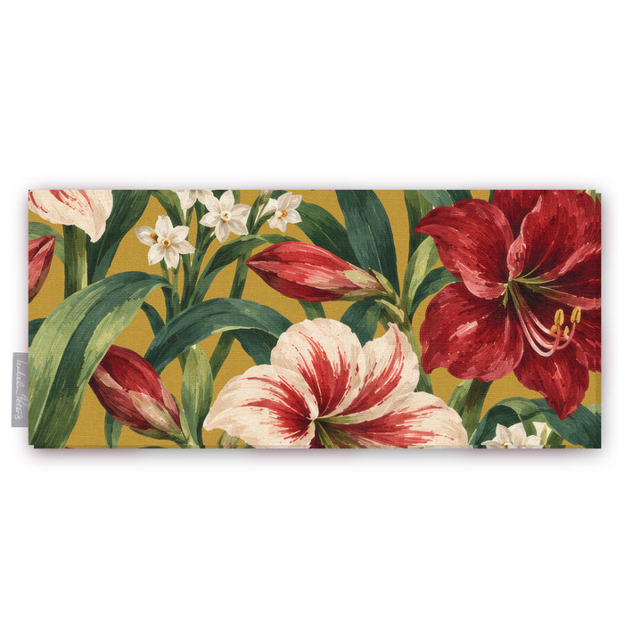 Gold Amaryllis Christmas table runner folded on white, showing amaryllis flowers among long leaves
