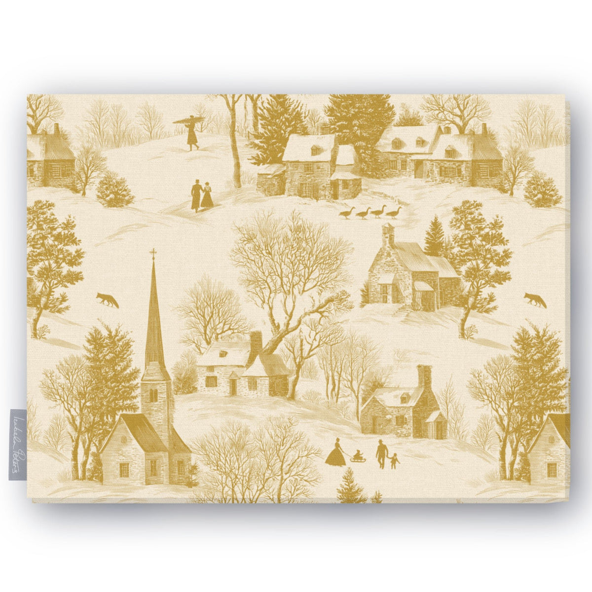 Village Toile Christmas tablecloth in gold on ivory, folded on white, showing a snowy village with a church and cottages