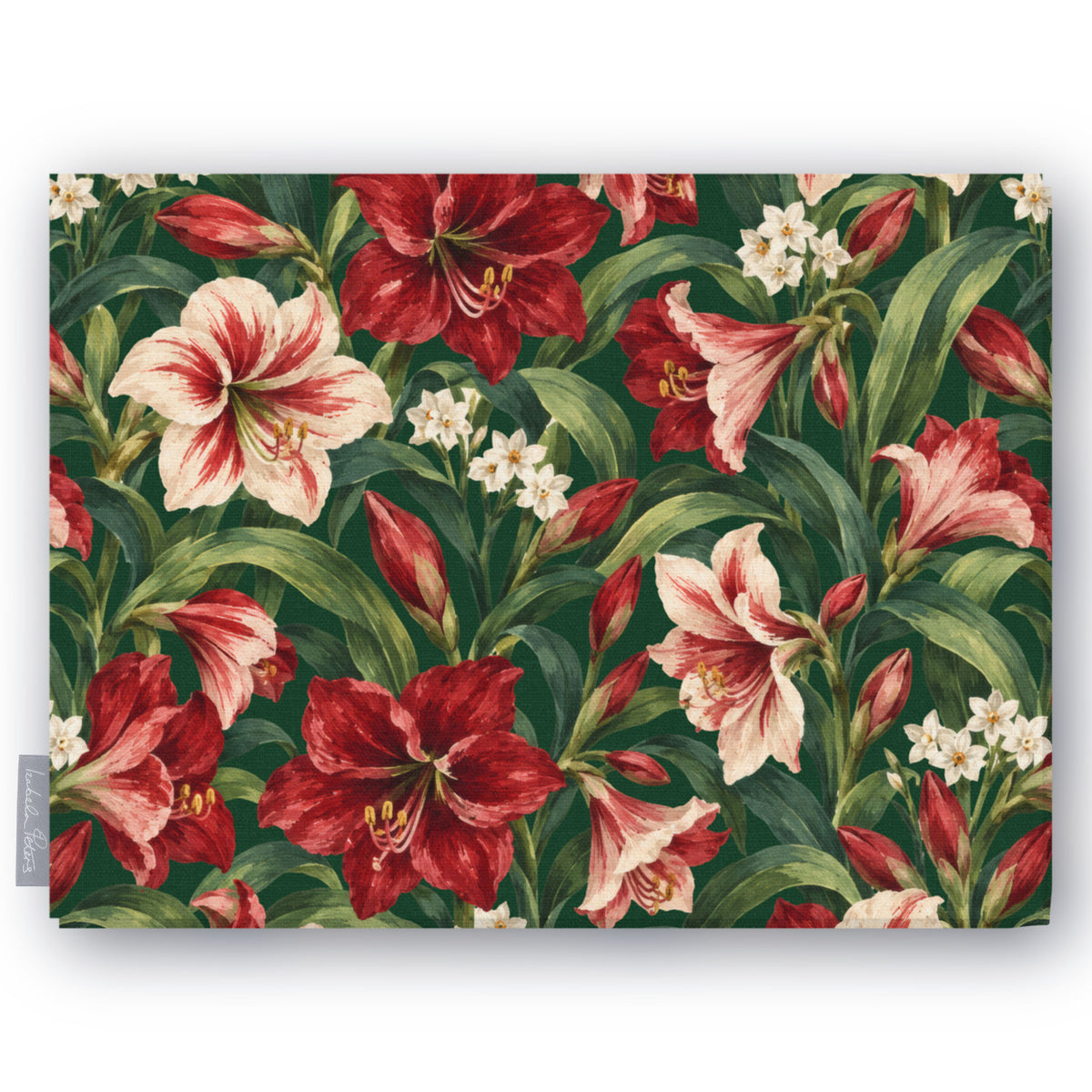 Green Amaryllis Christmas tablecloth folded on white, showing amaryllis flowers among long leaves