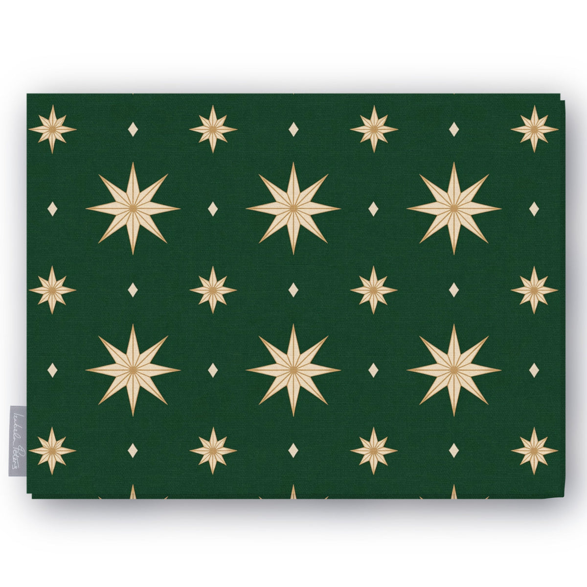 Stars Christmas tablecloth in green and gold, folded on white, showing gold eight-pointed stars