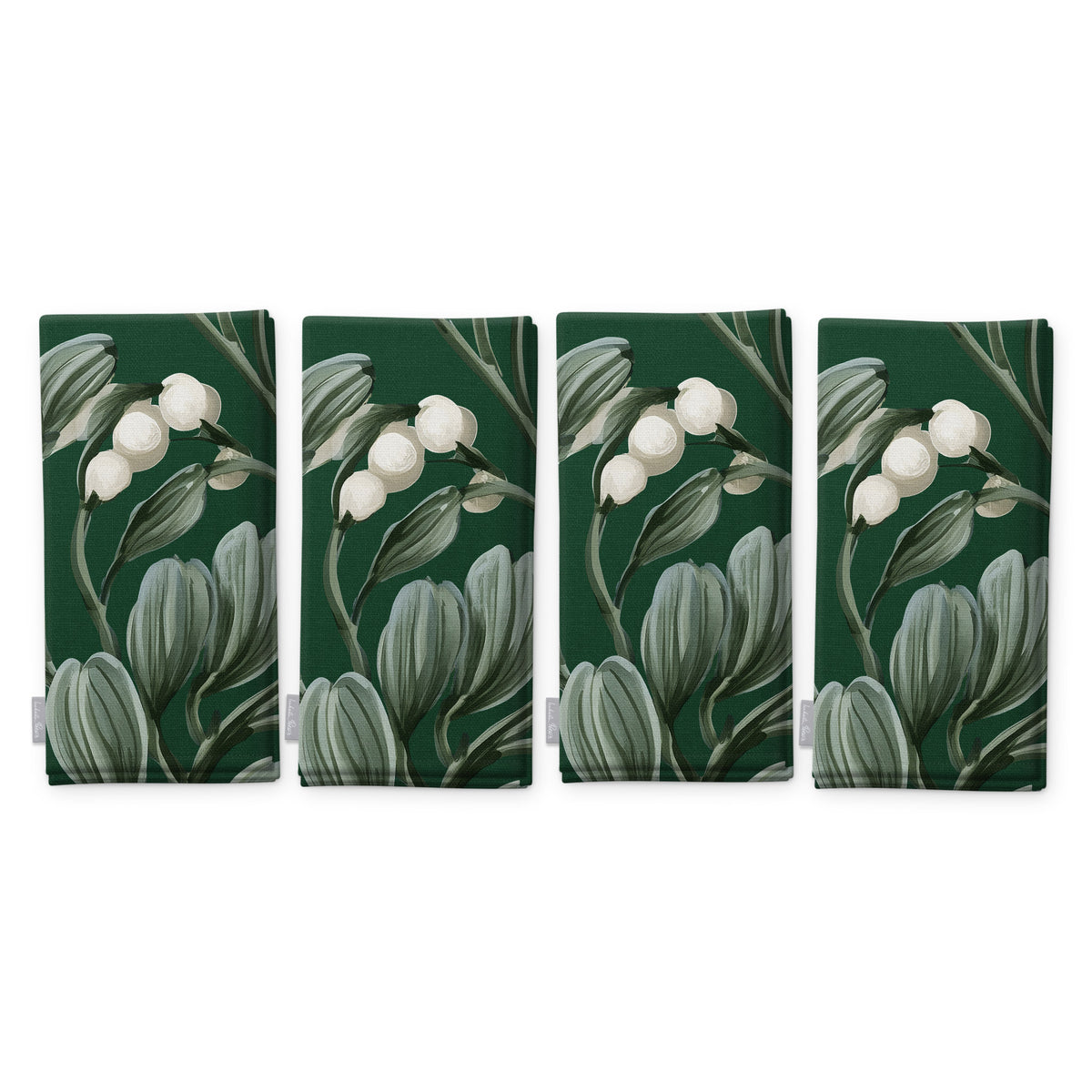 Green Mistletoe Christmas napkins, set of four, folded on white, showing the same sprig of mistletoe with white berries