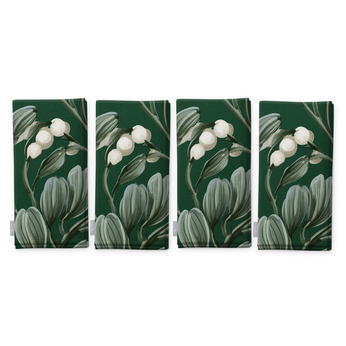 Green Mistletoe Christmas napkins, set of four, folded on white, showing the same sprig of mistletoe with white berries