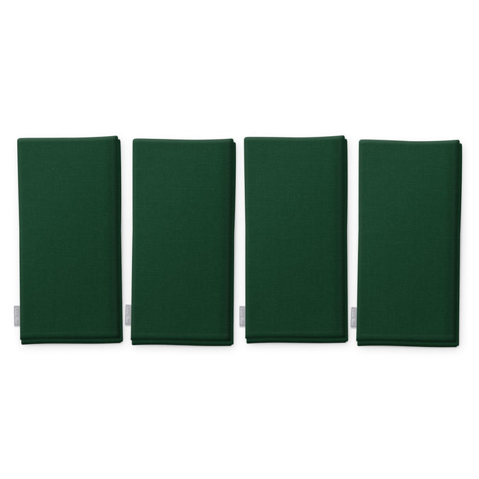 Plain green cotton Christmas napkins, set of four, folded on white