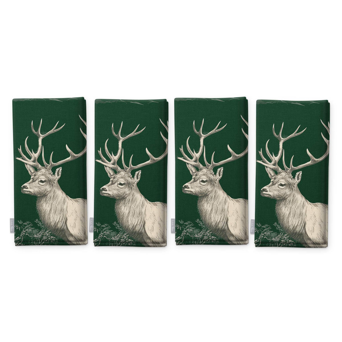 Green Stag Woodland Christmas napkins, set of four, folded on white, showing the same stag head