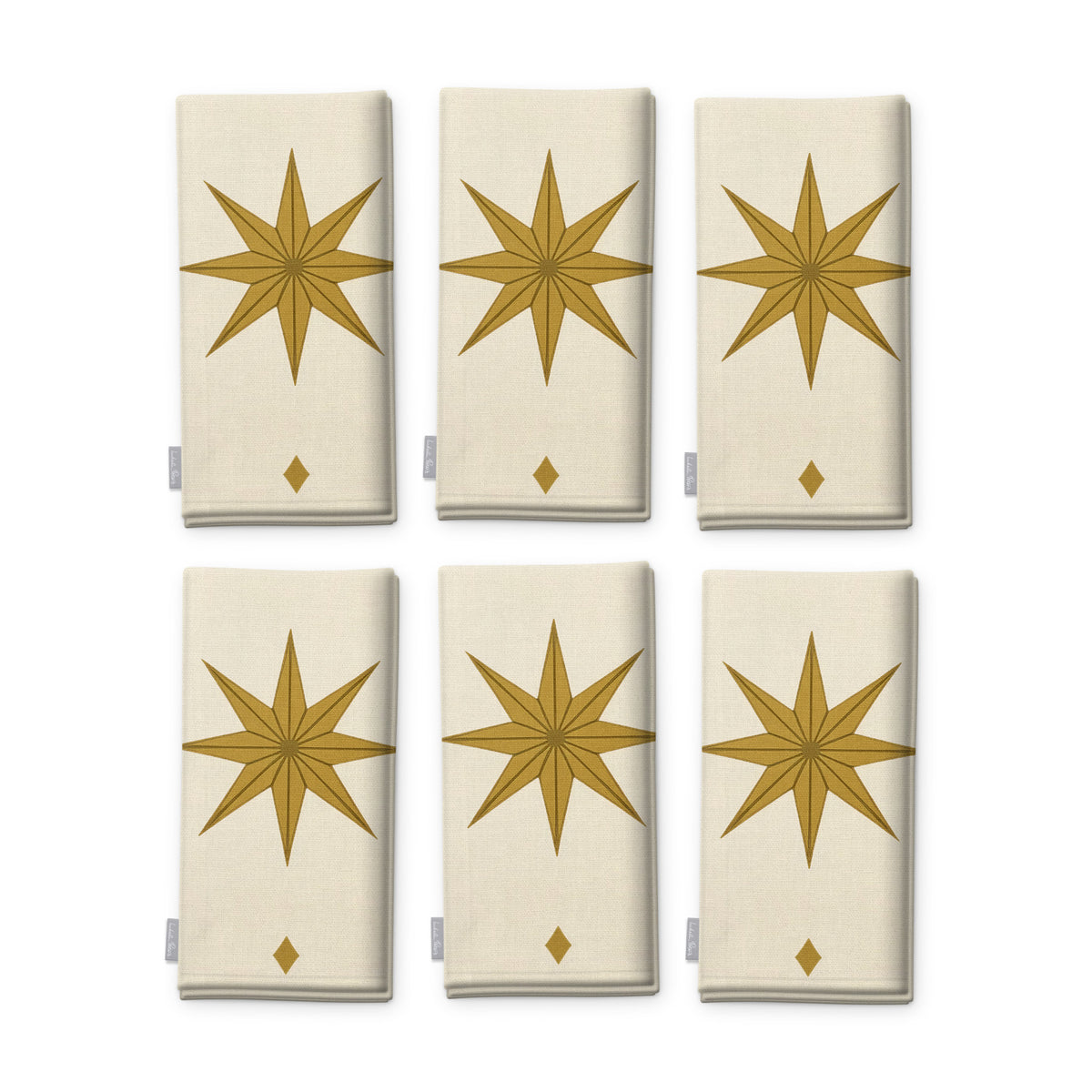 Stars Christmas napkins in ivory and gold, set of six, folded on white, showing the same large gold eight-pointed star