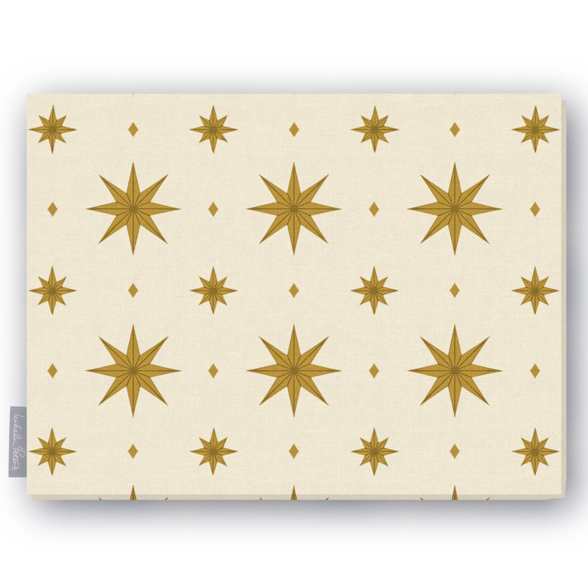 Stars Christmas tablecloth in ivory and gold, folded on white, showing gold eight-pointed stars