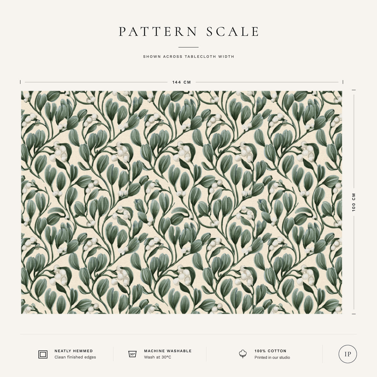 Pattern scale of the Mistletoe Christmas tablecloth in ivory across its 144 cm width, with care notes