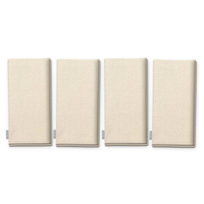 Plain ivory cotton Christmas napkins, set of four, folded on white