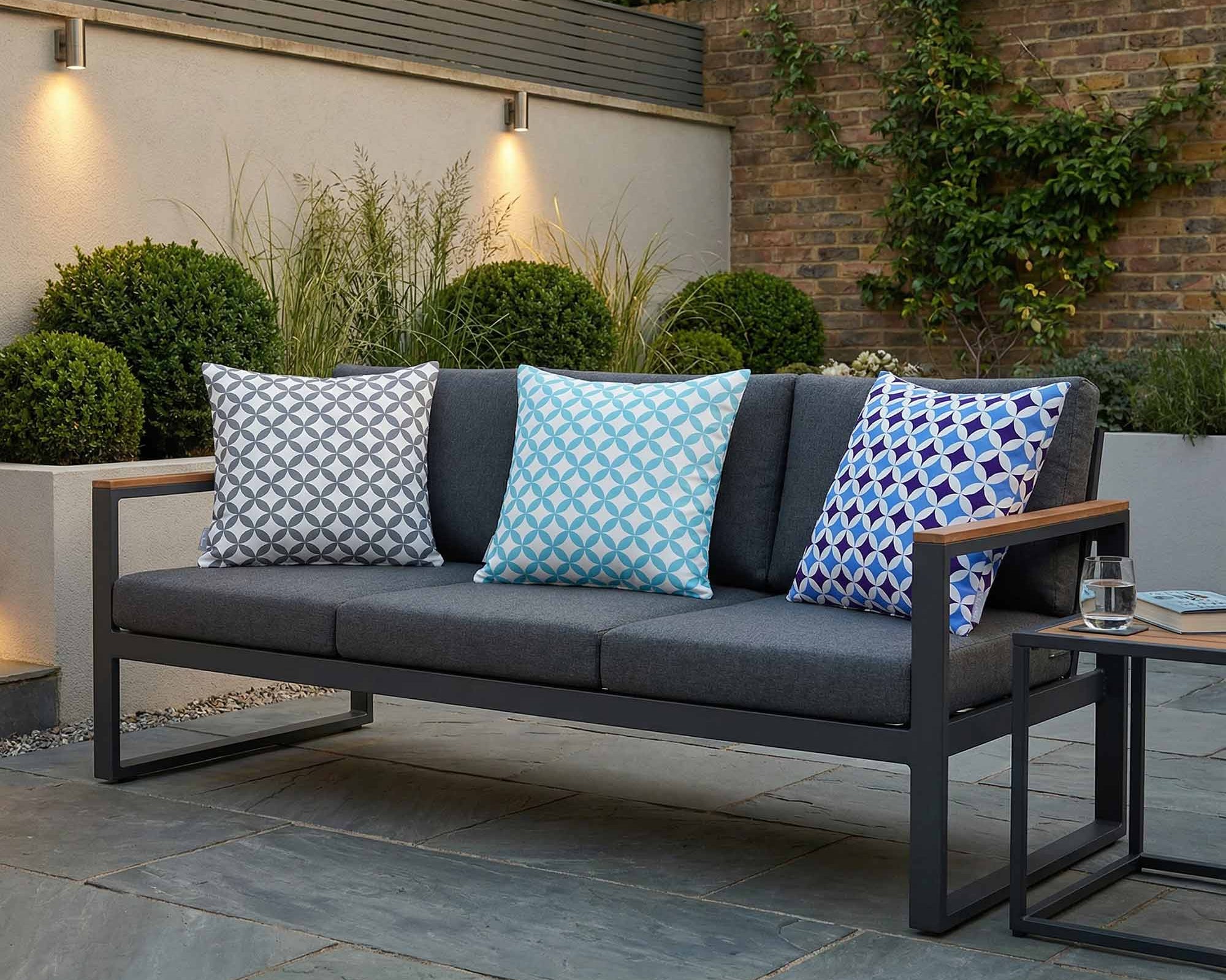 Outdoor Marrakech patterned cushions in grey and blue on a modern garden sofa