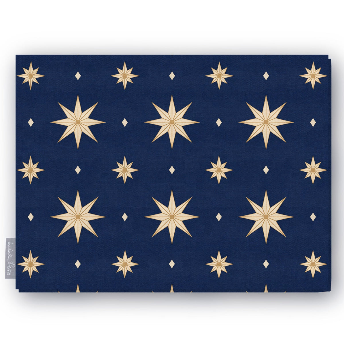 Stars Christmas tablecloth in navy and gold, folded on white, showing gold eight-pointed stars