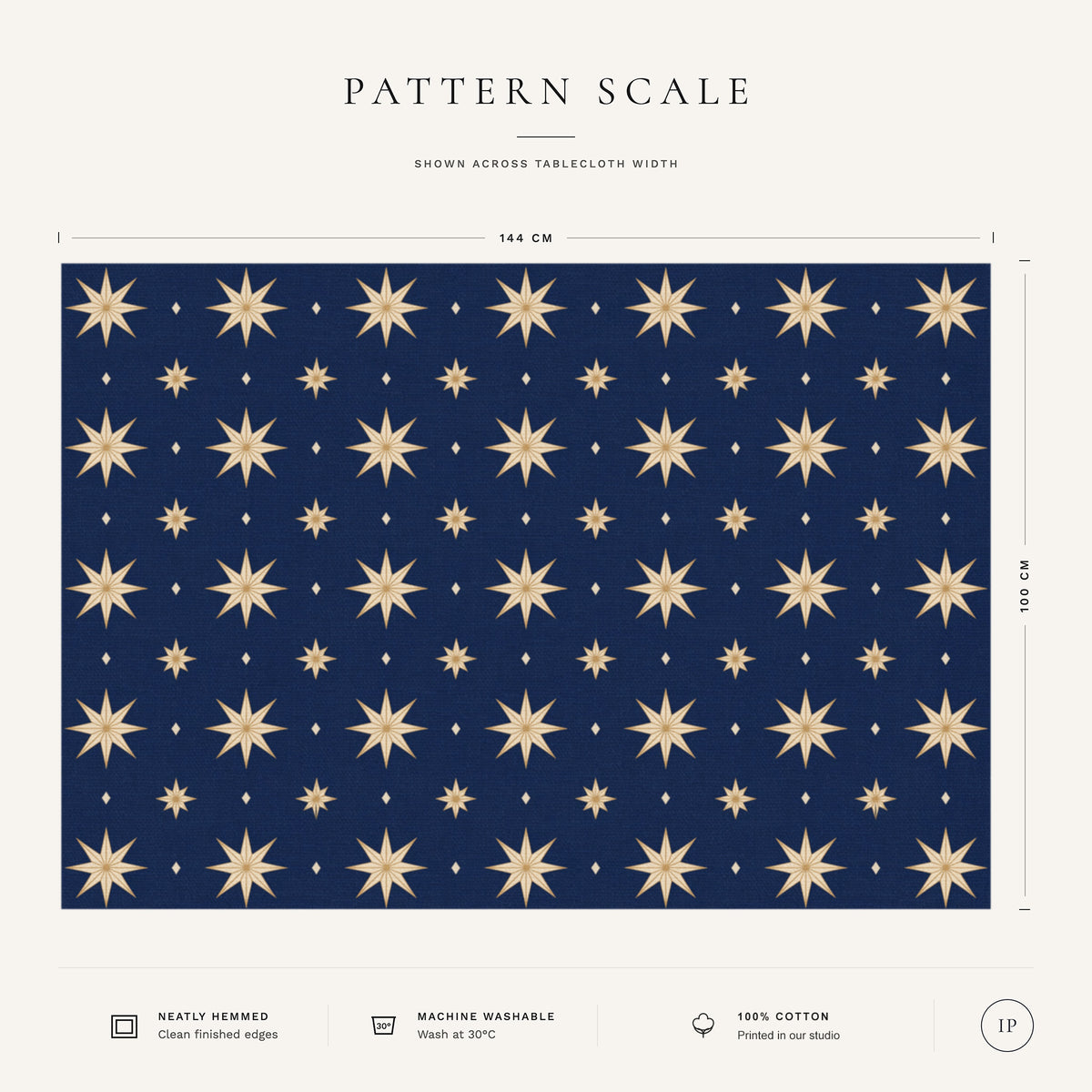 Pattern scale of the Stars Christmas tablecloth in navy and gold across its 144 cm width, with care notes