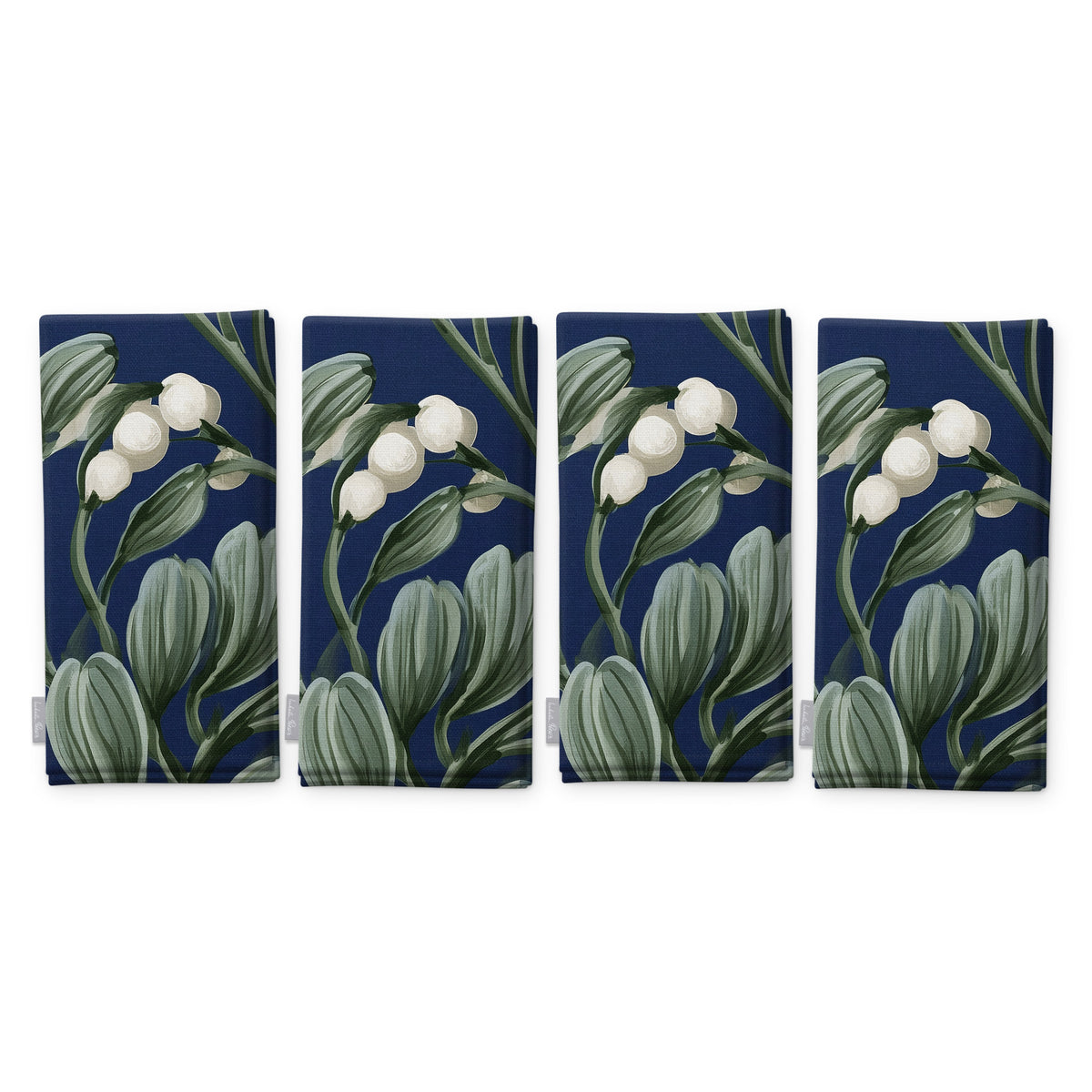 Navy Mistletoe Christmas napkins, set of four, folded on white, showing the same sprig of mistletoe with white berries