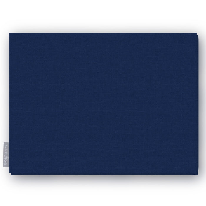 Plain navy cotton Christmas tablecloth folded on white