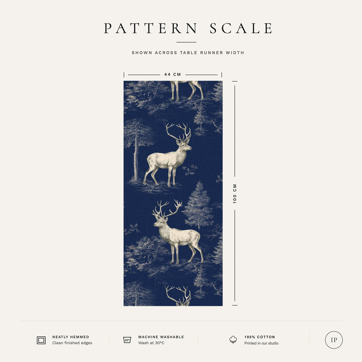 Pattern scale of the navy Stag Woodland Christmas table runner across its 44 cm width, with fabric and care notes