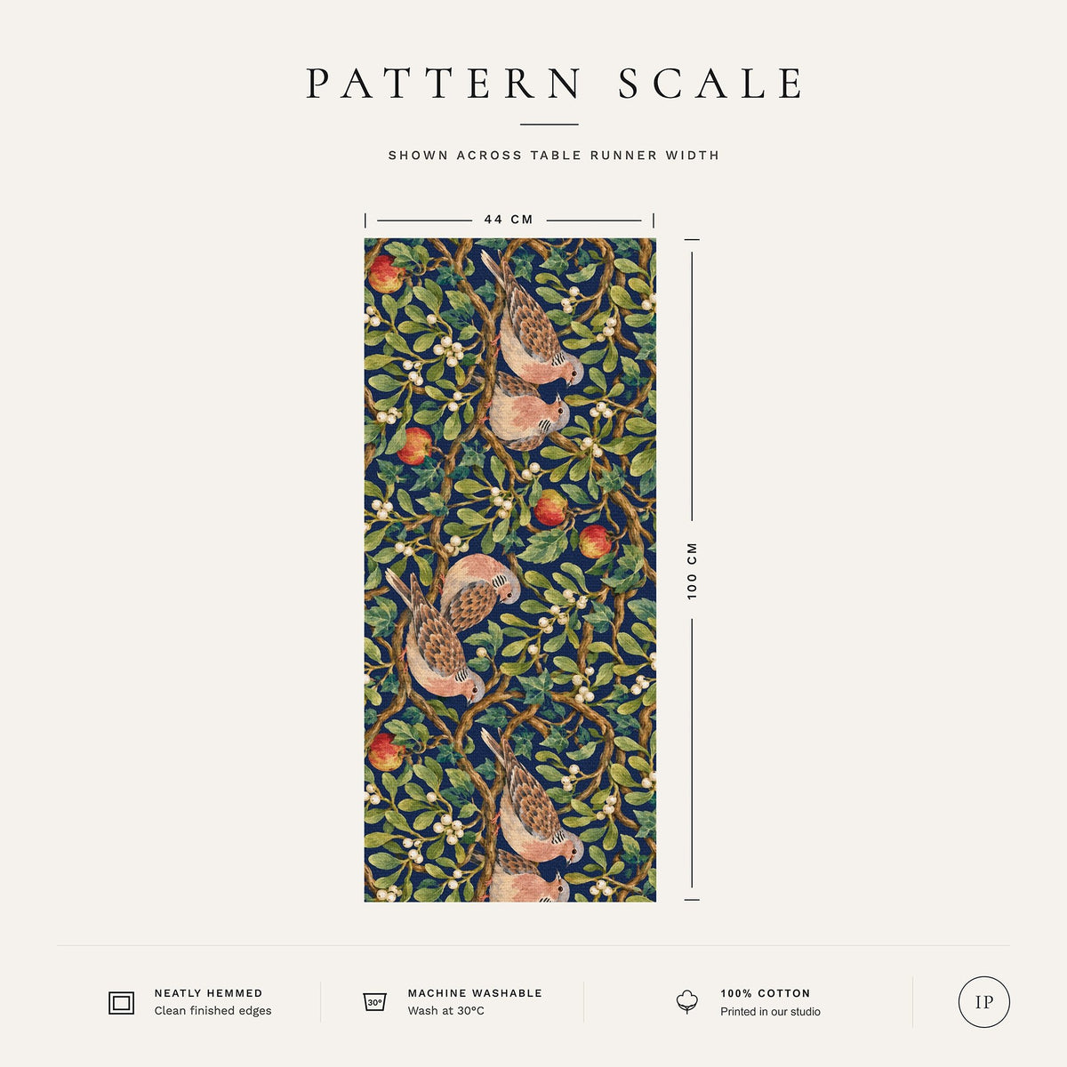 Pattern scale of the Turtle Doves and Mistletoe Christmas table runner in navy across its 44 cm width, with care notes