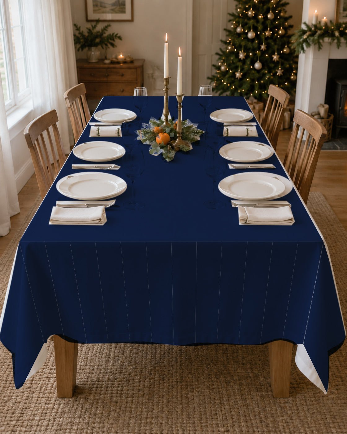 Plain navy Christmas tablecloth on a laid table