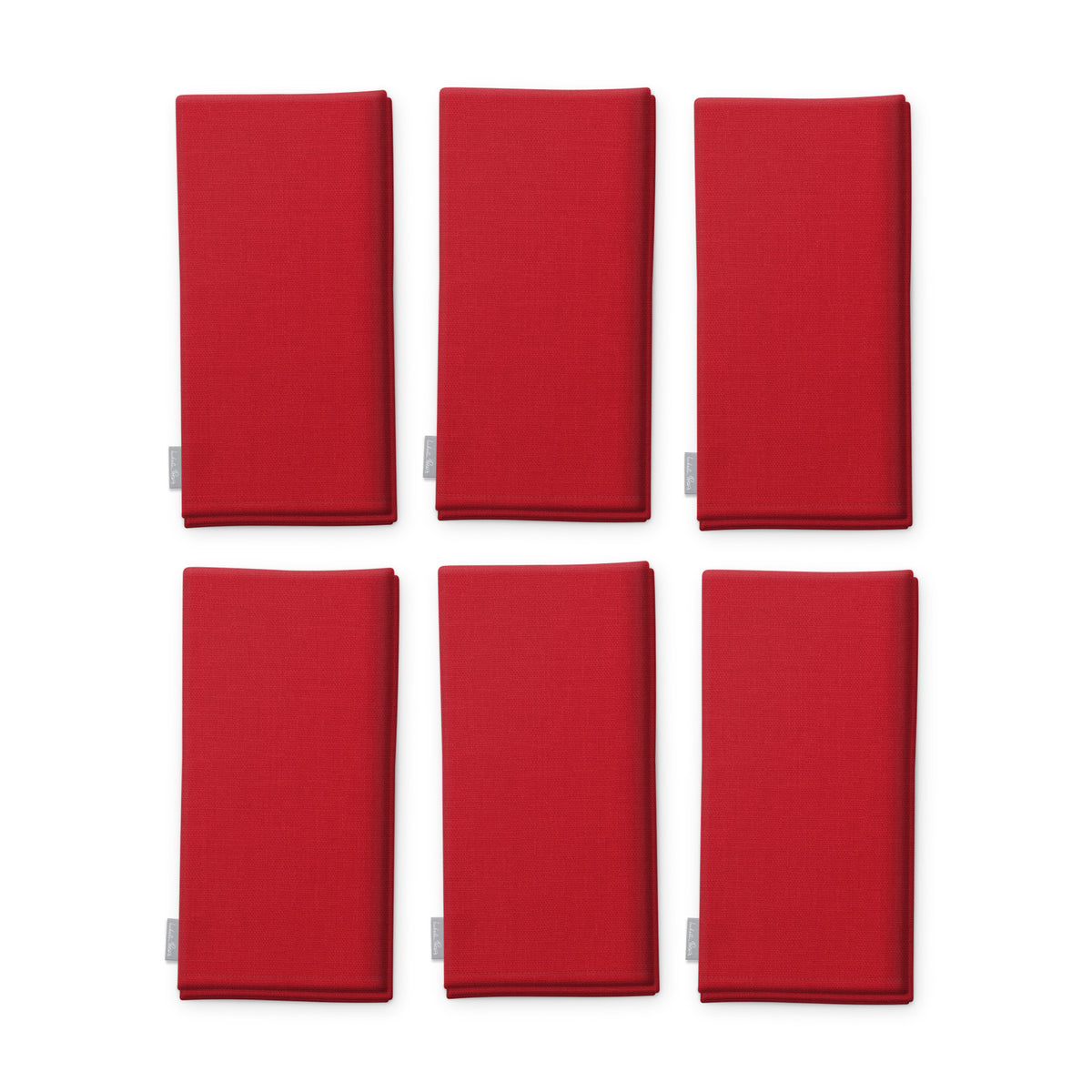 Plain red cotton Christmas napkins, set of six, folded on white