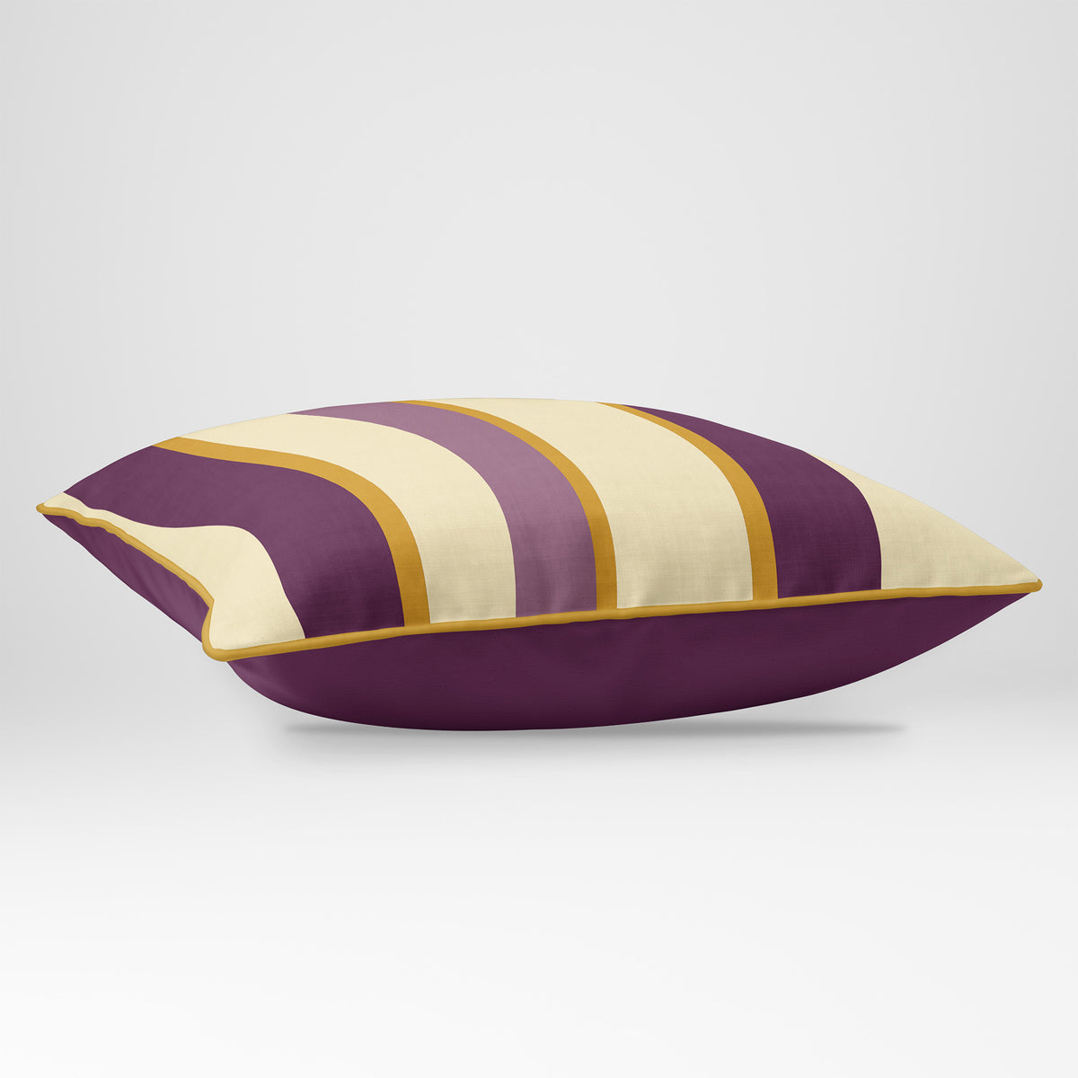 Angled view showing the front and Rich Plum plain reverse of a Ribbon Stripe rectangular cushion in Plum & Saffron, finished with Saffron piping.