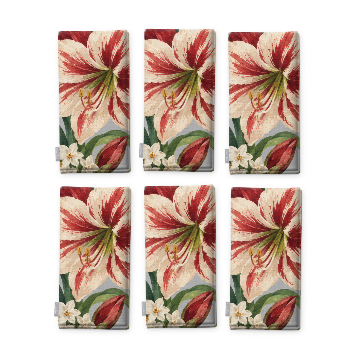 Amaryllis Christmas napkins in silver grey, set of six, folded on white, showing the same amaryllis flower