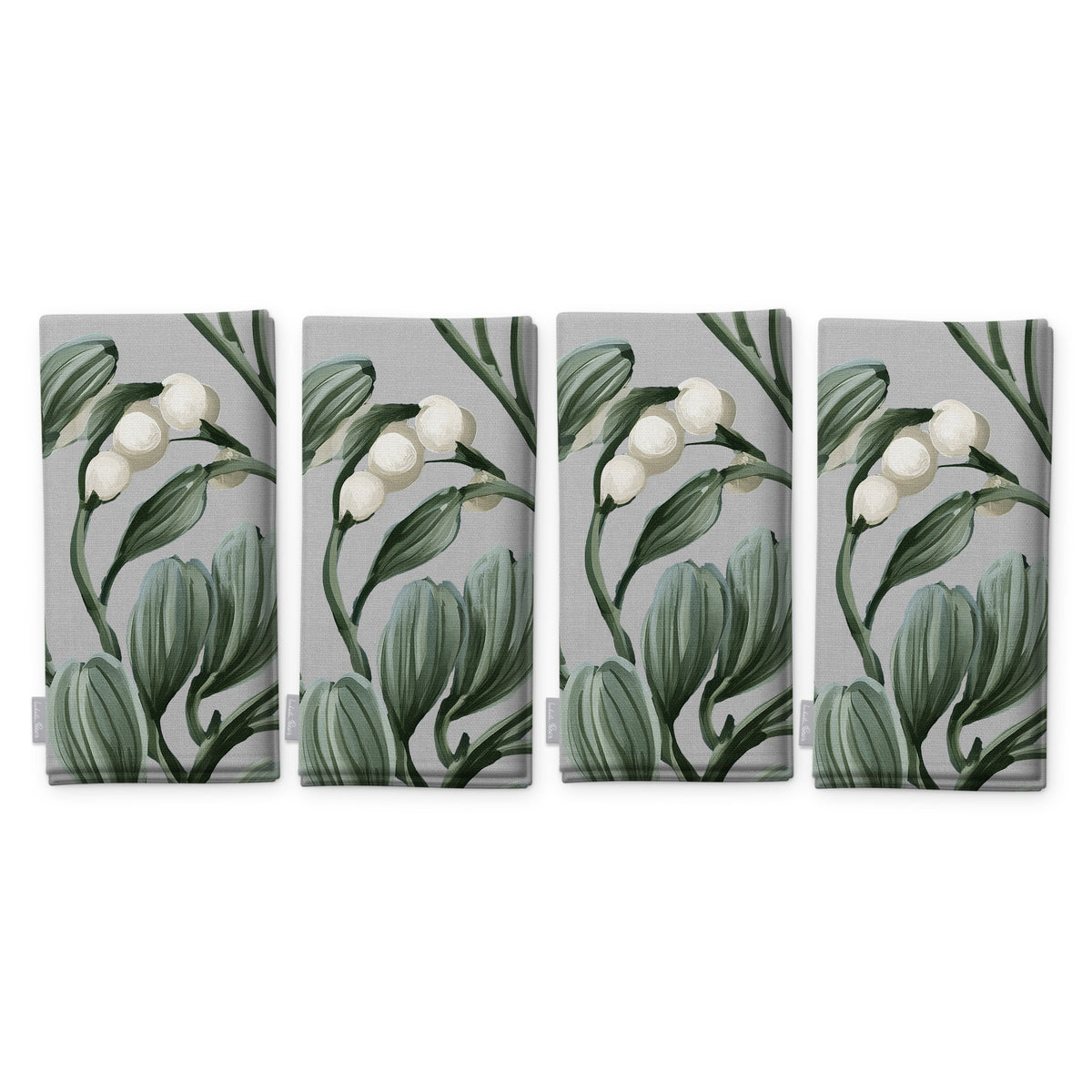 Mistletoe napkins in silver grey, set of four, folded on white, showing the same sprig of mistletoe with white berries