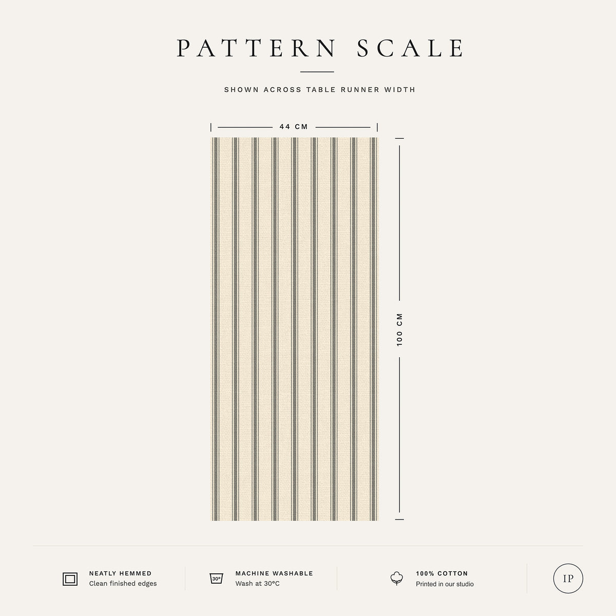 Pattern scale of the Ticking Stripe Christmas table runner in silver grey on ivory across its 44 cm width, with care notes