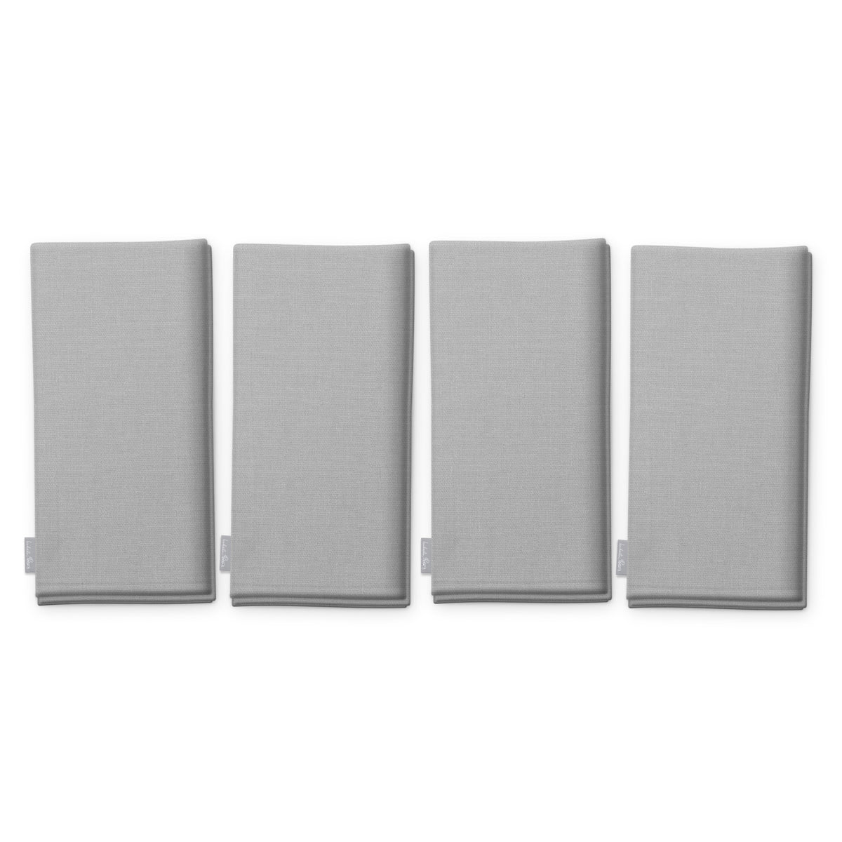 Plain silver cotton Christmas napkins, set of four, folded on white