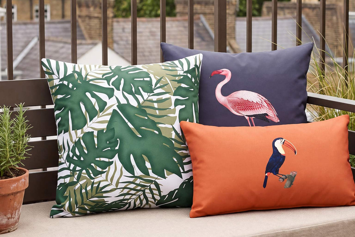 Palm leaf, flamingo and toucan outdoor cushions styled on a London roof terrace
