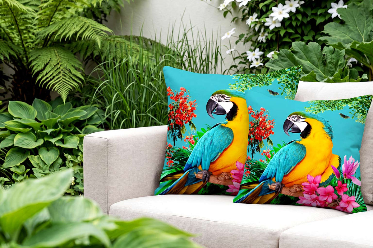Decorative pillows with parrot design on a couch in a garden setting