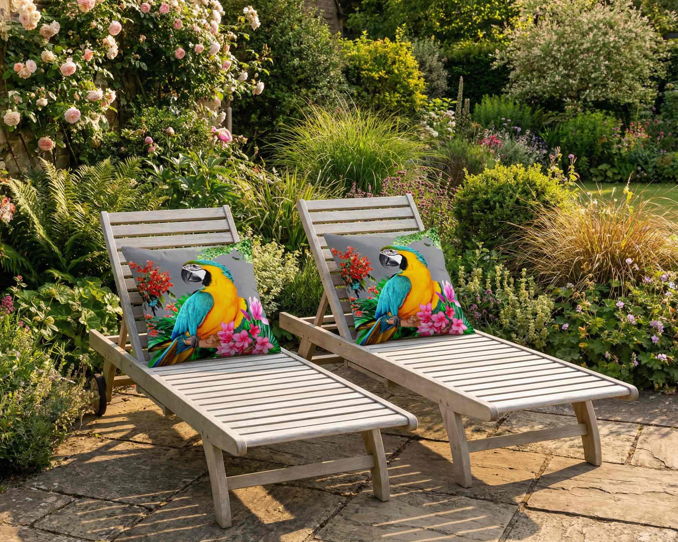 Outdoor parrot print cushions by Izabela Peters on wooden sun loungers in a British garden