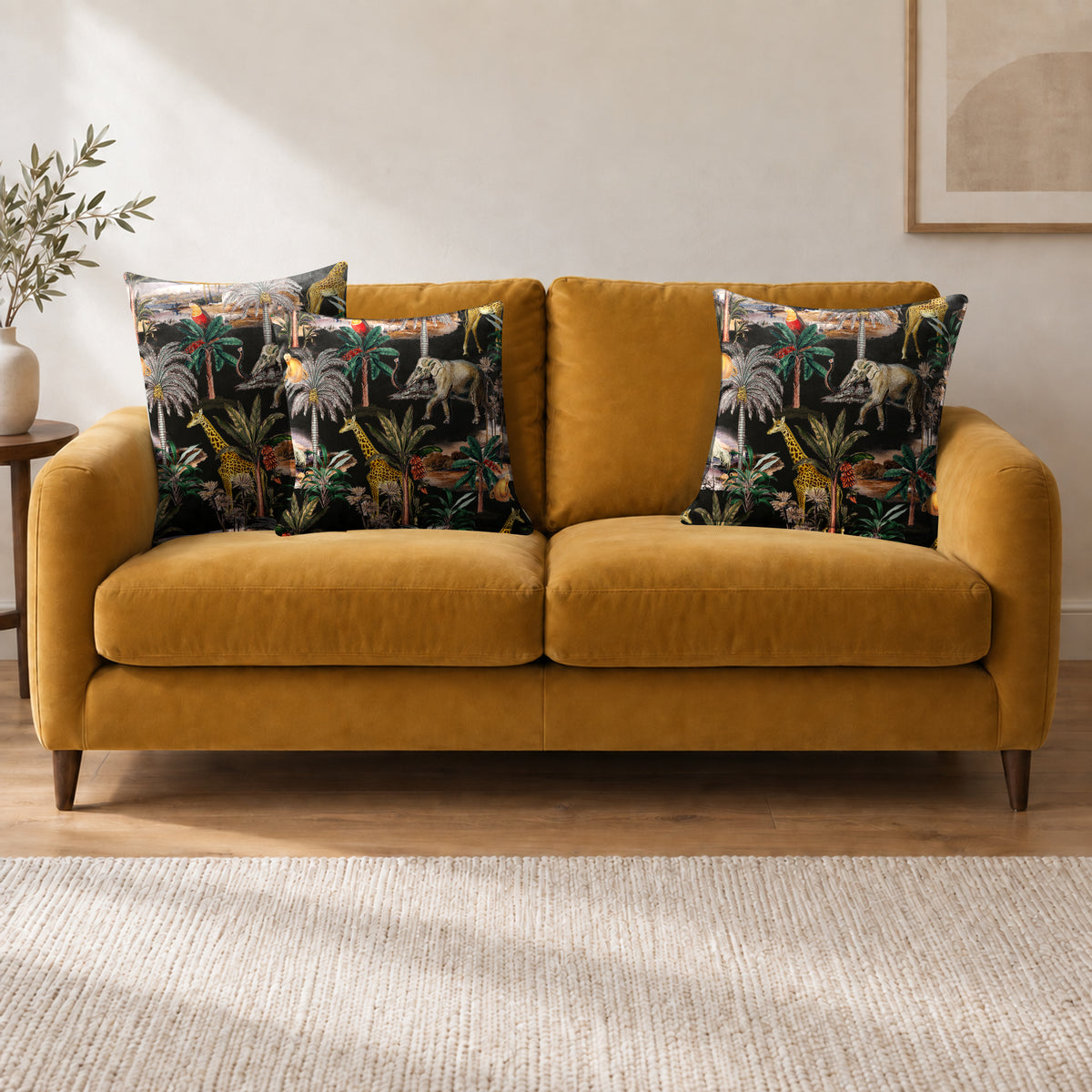 Safari Voyage cushion in Charcoal on a sofa