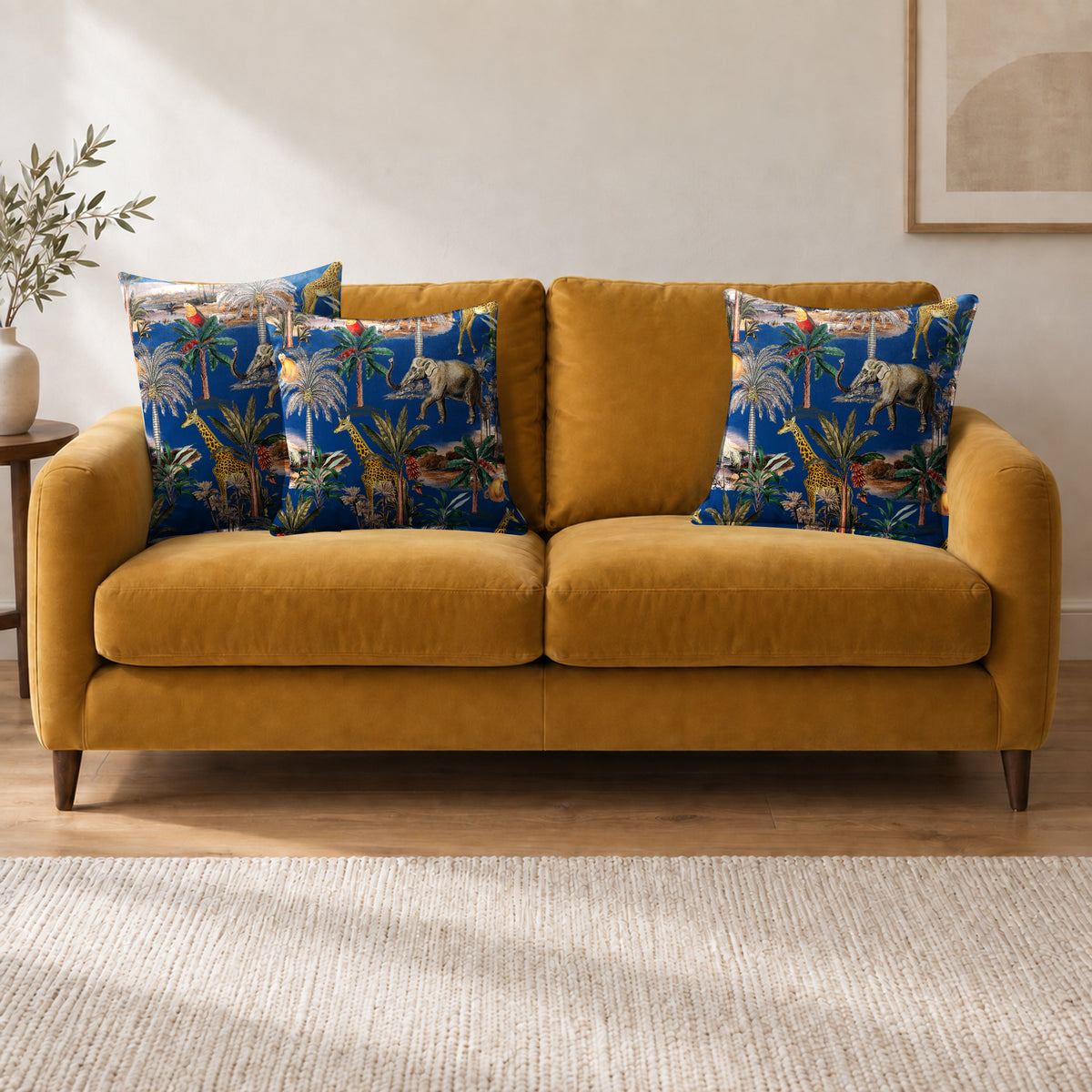 Safari Voyage cushion in Estate Blue on a sofa