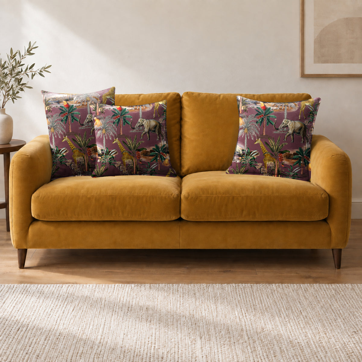Safari Voyage cushion in Italian Grape on a sofa