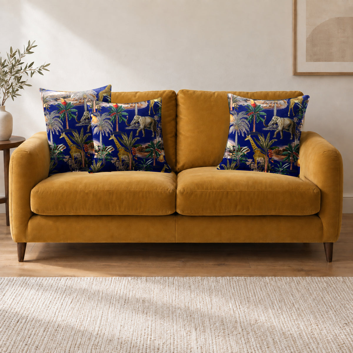 Safari Voyage cushion in Midnight on a sofa