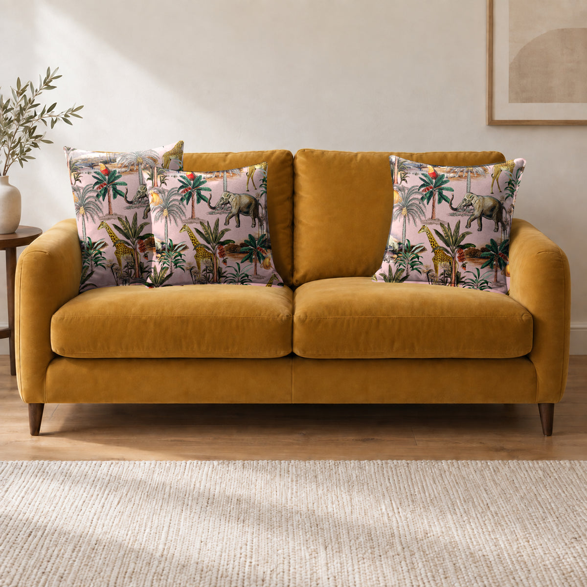 Safari Voyage cushion in Rosewater on a sofa