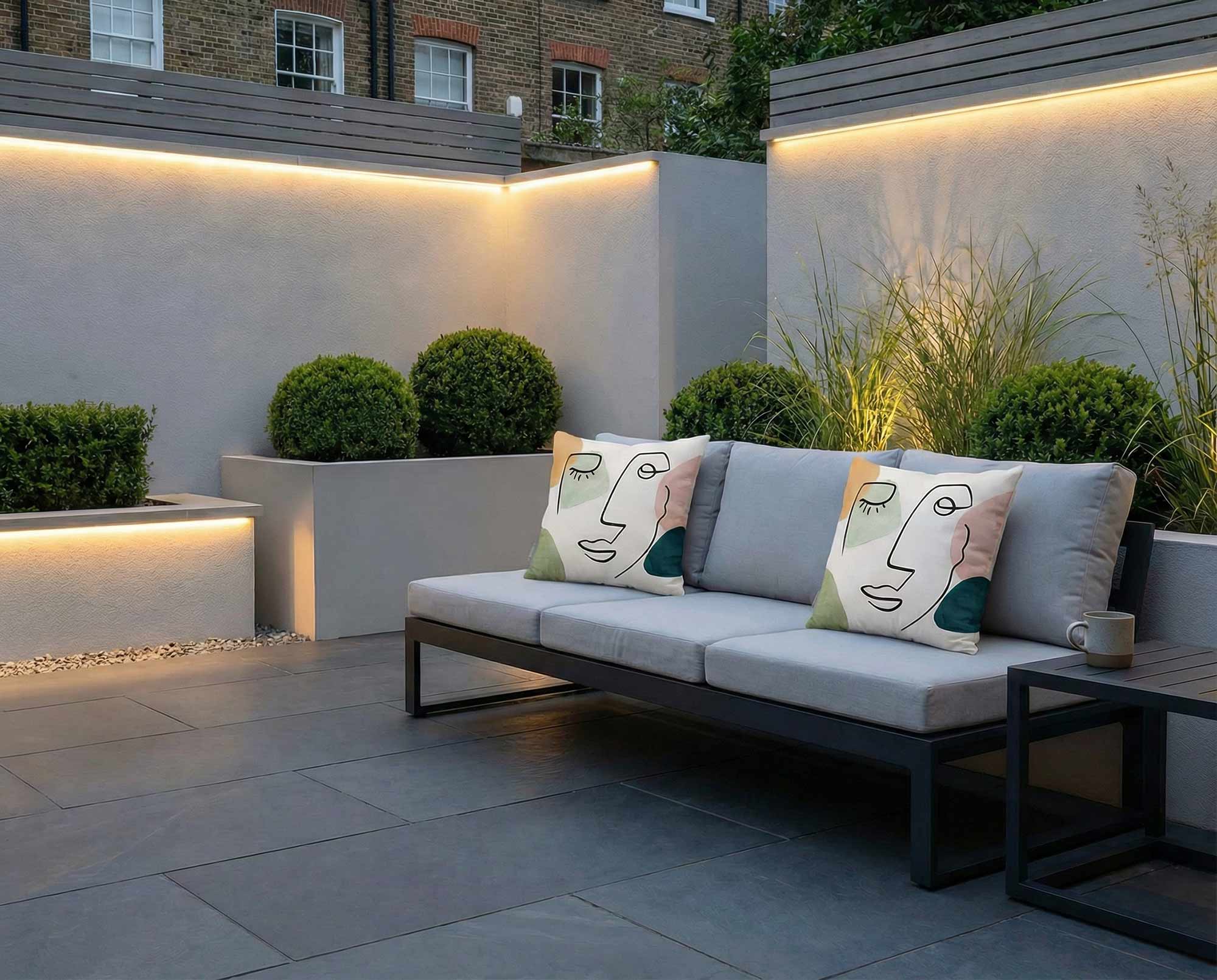 Abstract outdoor cushions on a modern garden sofa in a contemporary London terrace