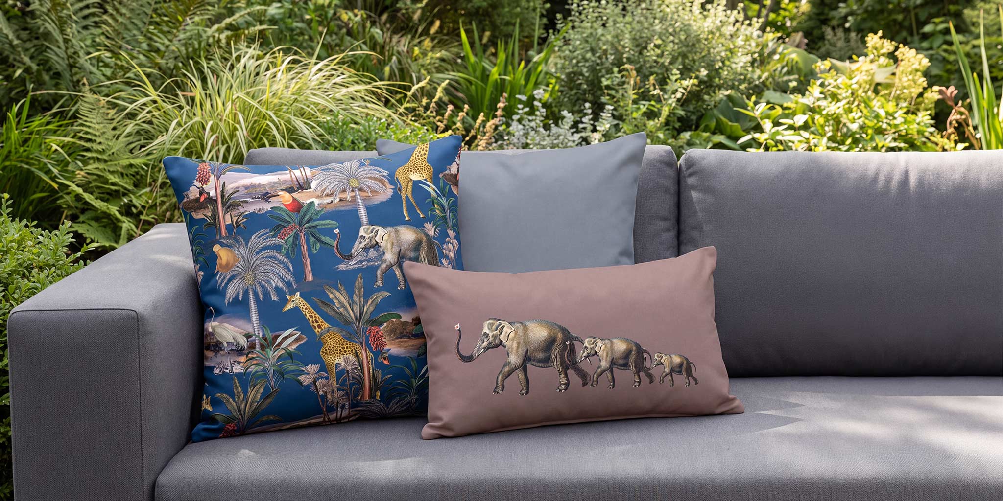 Safari Voyage and Elephants outdoor cushions on a graphite garden sofa