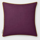 Avara Plain Plum & Saffron linen-look square cushion, piped, front view.