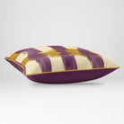 Angled view showing the front and Rich Plum plain reverse of a Broad Check rectangular cushion in Plum & Saffron, finished with Saffron piping.