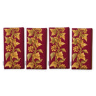 Gilded Ivy Christmas napkins in burgundy and gold, set of four folded napkins showing the same trail of gold ivy and berries