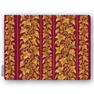 Gilded Ivy Christmas tablecloth in burgundy and gold, folded on white, showing trails of gold ivy and berries