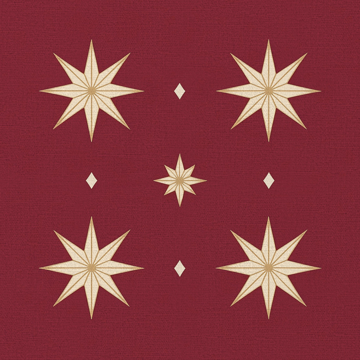 Close-up of the Stars Christmas napkin print in burgundy and gold on cotton, showing gold eight-pointed stars